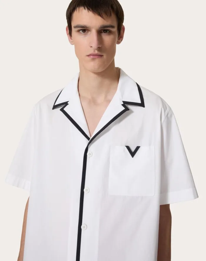 Valentino Shirts Man Cotton Poplin Bowling Shirt With Rubberized V Detail For Man In White White Valentino Shirts Man Cotton Poplin Bowling Shirt With Rubberized V Detail For Man In White White
